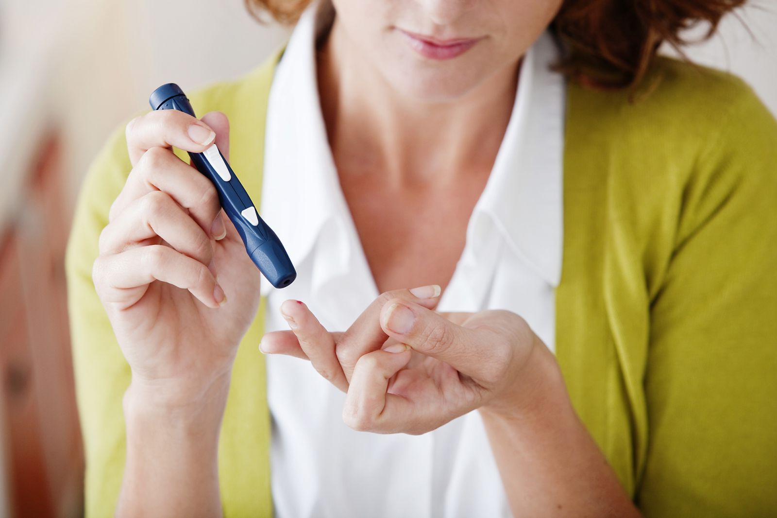 A person studying books and research papers on health.